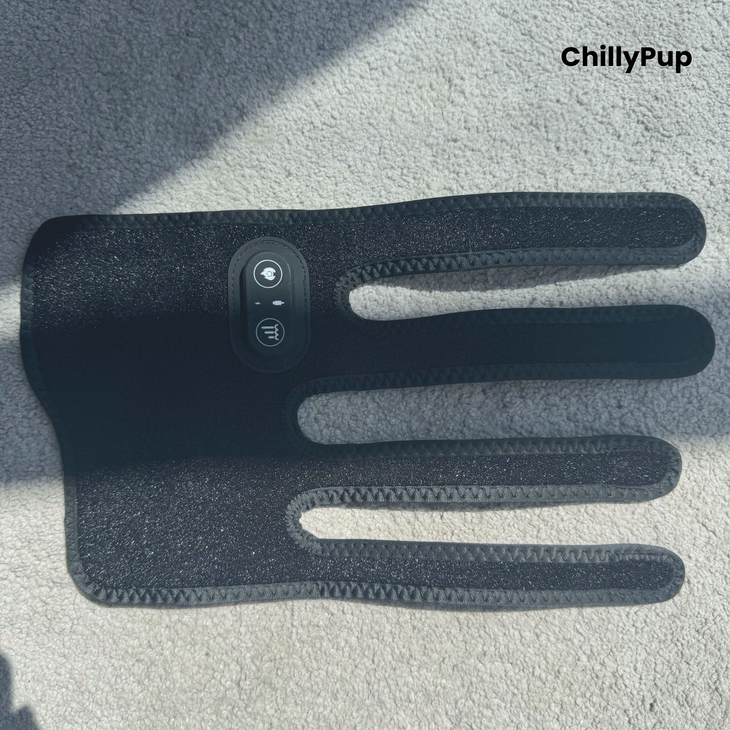 A black redlight leg wrap facing down on a carpet with ChillyPup branding.
