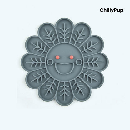 Grey pet lick mat with a smiling face design on a white background, branded 'ChillyPup'.