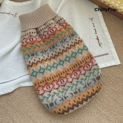 Knitted dog jumper with colourful pattern on a white surface, brand 'ChillyPup' visible.